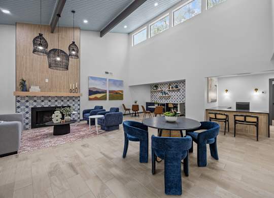 A modern living room with a fireplace and a dining table.