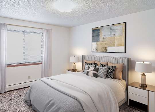 A bedroom with a large bed, a potted plant, and a window with curtains.