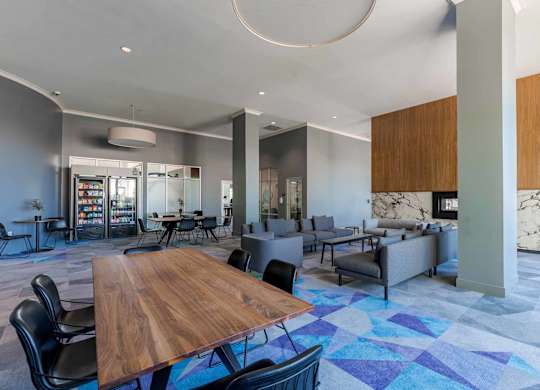 A modern dining area with a wooden table surrounded by chairs.