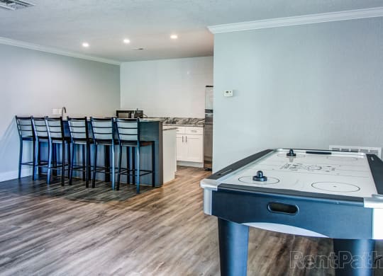 The Commons Apartments in Tampa Florida photo of clubhouse with air hockey table