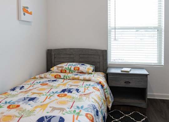 a bedroom with a bed and a window
