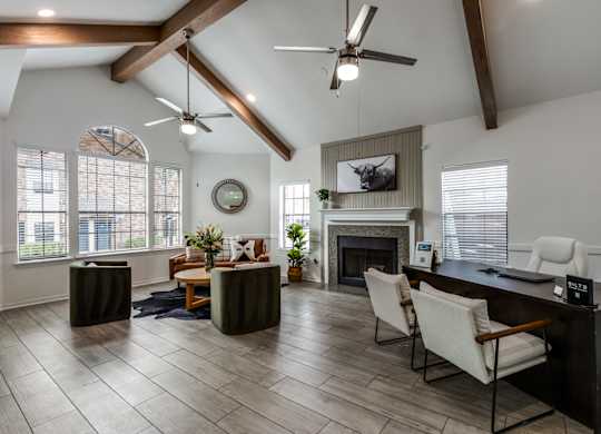 A modern living room with a fireplace and a television.