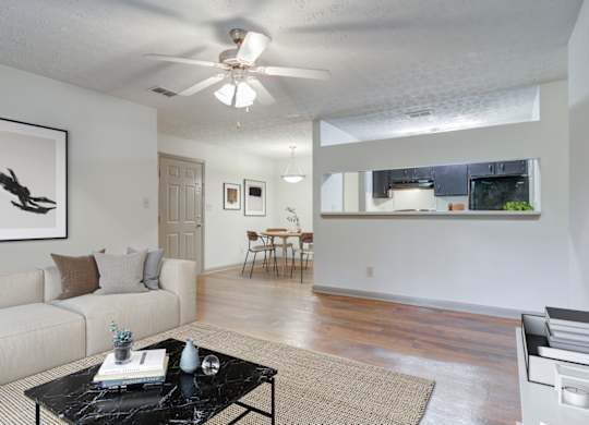 Spacious living room with hardwood-style flooring at Place at Midway apartments in Douglasville near Lithia Springs, GA