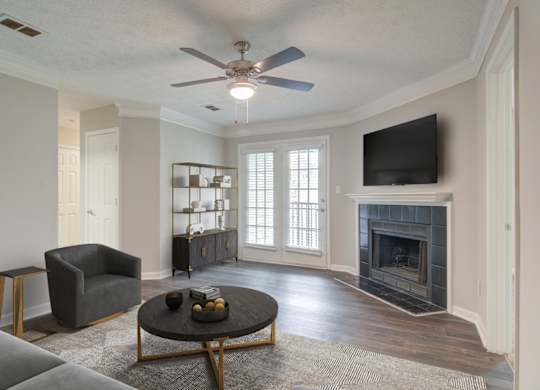 Living room with fireplace at Place at Midway apartments in Douglasville near Lithia Springs, GA