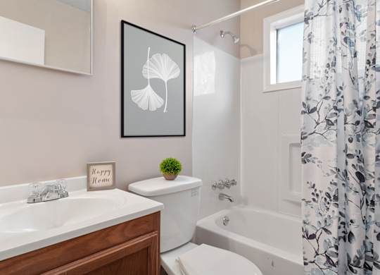 Bathroom with tub and shower at Mableton Ridge Apartments in Mableton, GA, near Douglasville.
