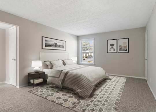 Bedroom with large window and soft plush carpeting at Mableton Ridge Apartments in Mableton, GA, near Douglasville.