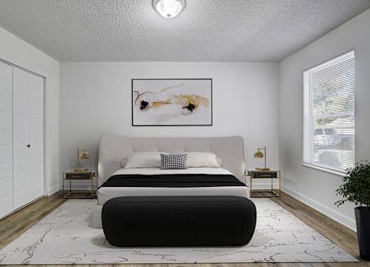 Renovated primary bedroom at Chelsea Apartments in Gainesville, Florida
