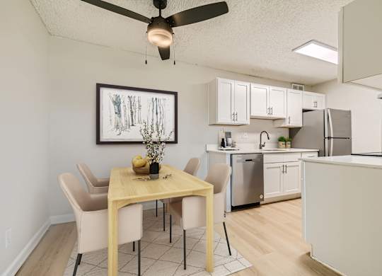 Spacious pet-friendly apartment dining area with ceiling fan at Aurora Meadows near Green Valley Ranch