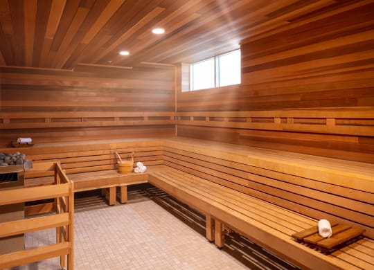 a wooden sauna with benches and a table