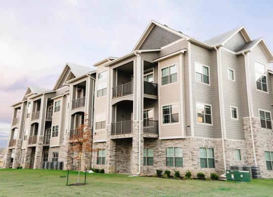 a large apartment building with balconies on the side of it