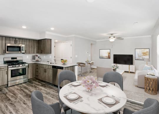 a kitchen and dining room with a table and chairs