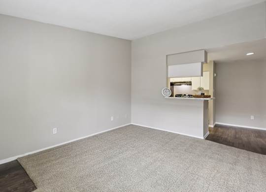 A small kitchenette with a white countertop and a small fridge.
