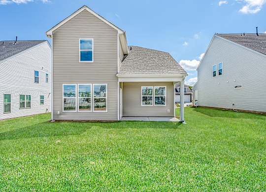 Fountain Inn, SC Houses For Rent - Pine Ridge Place - Back Yard Of House Surrounded By Lush Grass And Houses Side By Side
