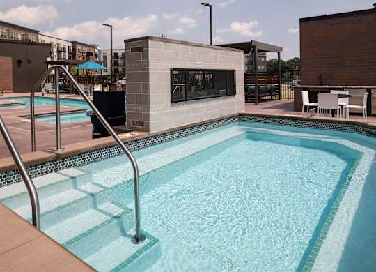A small pool with a metal ladder.