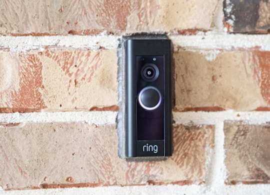 a ring video doorbell mounted on a brick wall
