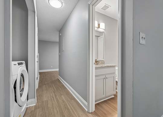 A laundry room with a washer and dryer.