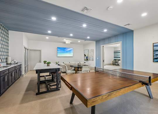 A modern dining room with a wooden table and chairs.