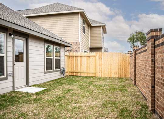 Luxury Homes for Rent in Humble TX - Edgewater at the Lagoon - Backyard with Grass