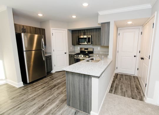a kitchen with stainless steel appliances and a counter top