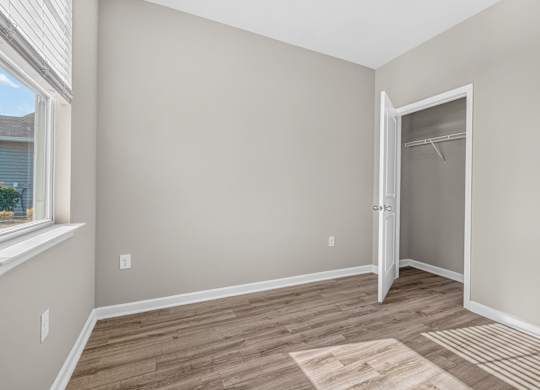A room with a door and a window.