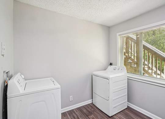 A laundry room with a washer and dryer.