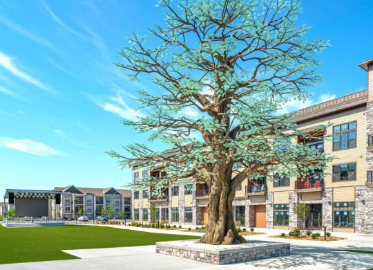 a large tree in front of a building