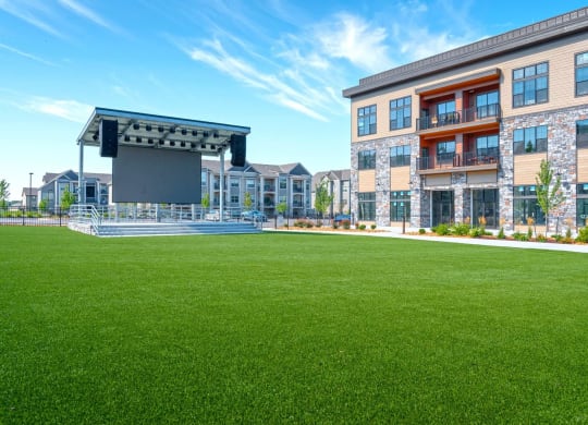 a lawn in front of a building with a lawn amphitheater