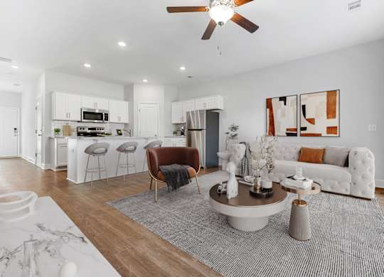 Cottonvale Towns in Savannah, GA photo of a living room with a couch and a table