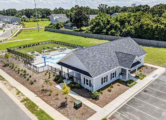 A house with a pool in the backyard.