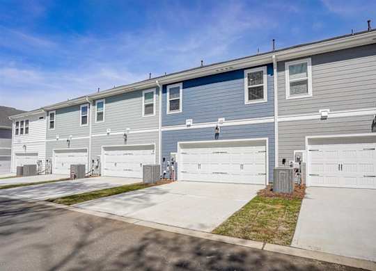 a blue house with a white garage door