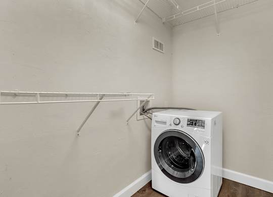 Addison Lane Apartment homes in Gainesville Florida photo of photo of a laundry room with a washer and dryer