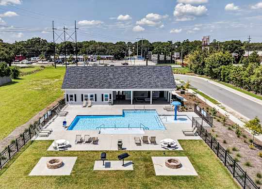 A large house with a pool in the backyard.