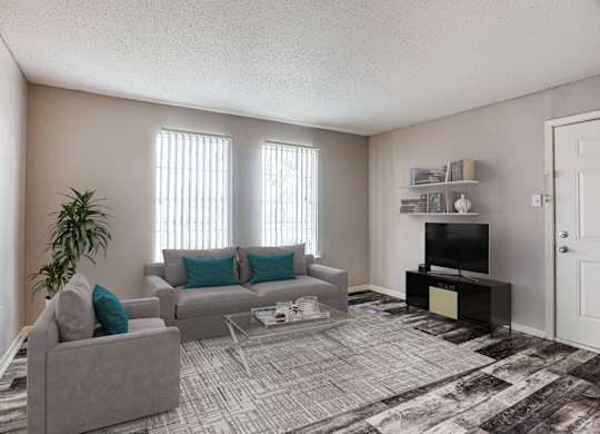 Fort Worth, TX Apartments for Rent- Monarch Pass- Living Room with Grey Furniture, Grey Rugs, and Large Windows