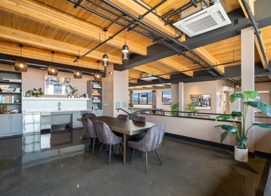 a large room with a table and chairs in it