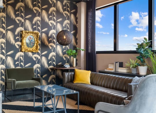 a living room with a couch and a table and a window