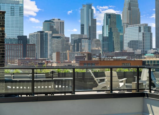 the view of the city from the rooftop deck of a building