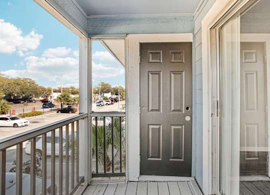 A grey door is on the left and a white door is on the right.