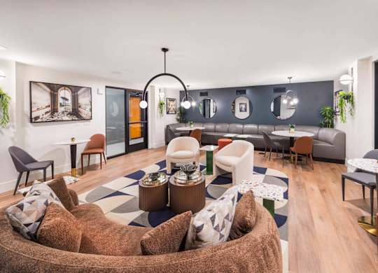 A modern living room with a large couch and a coffee table.