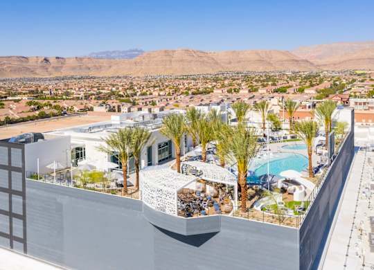 A rooftop pool with a view of the desert.