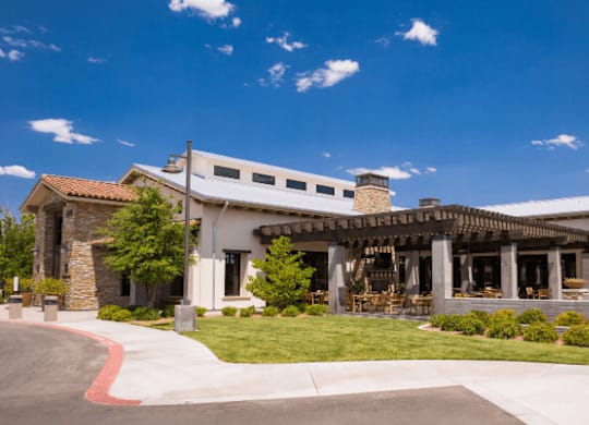 A large building with a covered patio area.