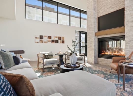 a living room filled with furniture and a large fireplace