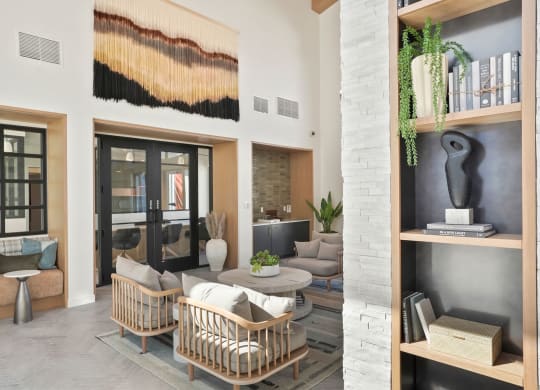a living room filled with furniture and a large window