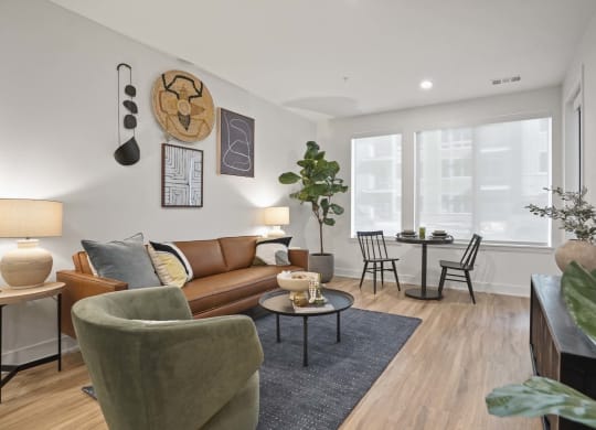 3-Bedroom Apartments in Castle Rock, CO - Alana - Spacious Living Room with Large Windows, Open Floorplan, and Luxury Plank Flooring