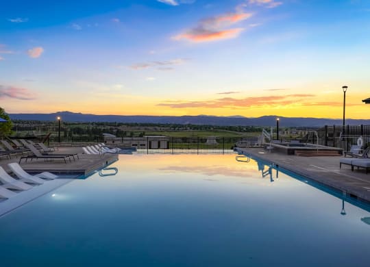 a swimming pool at sunset at the resort at governors crossing