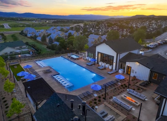 an aerial view of the pool at sunset at the resort at governors crossing