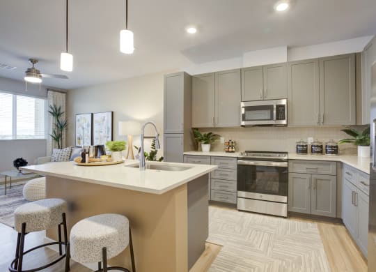 South Scottsdale Apartments - Lucent Scottsdale - Luxury Kitchen with Quartz countertops with undermount sinks and ceramic tile backsplash.