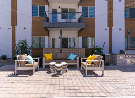 South Scottsdale, AZ Apartments - Lucent Scottsdale - Sparkling Pool With Tanning Ledge, Cabanas, Lounge Chairs, Tables, And Umbrellas