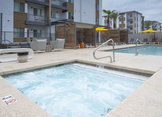 Scottsdale, AZ, Apartments - Lucent Scottsdale - Pool with Hot Tub, Poolside Seating, Lounge, and Cabanas.