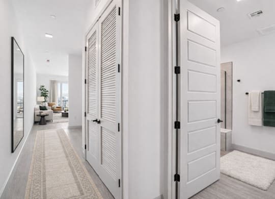 A white door with a black handle is open.