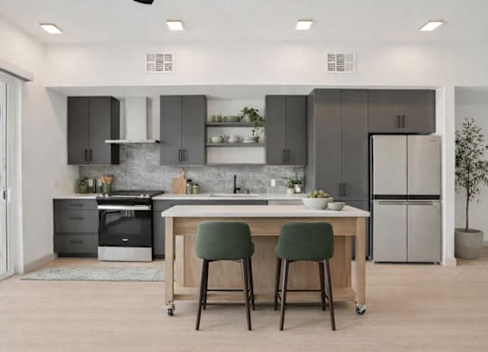 A modern kitchen with a table and chairs.